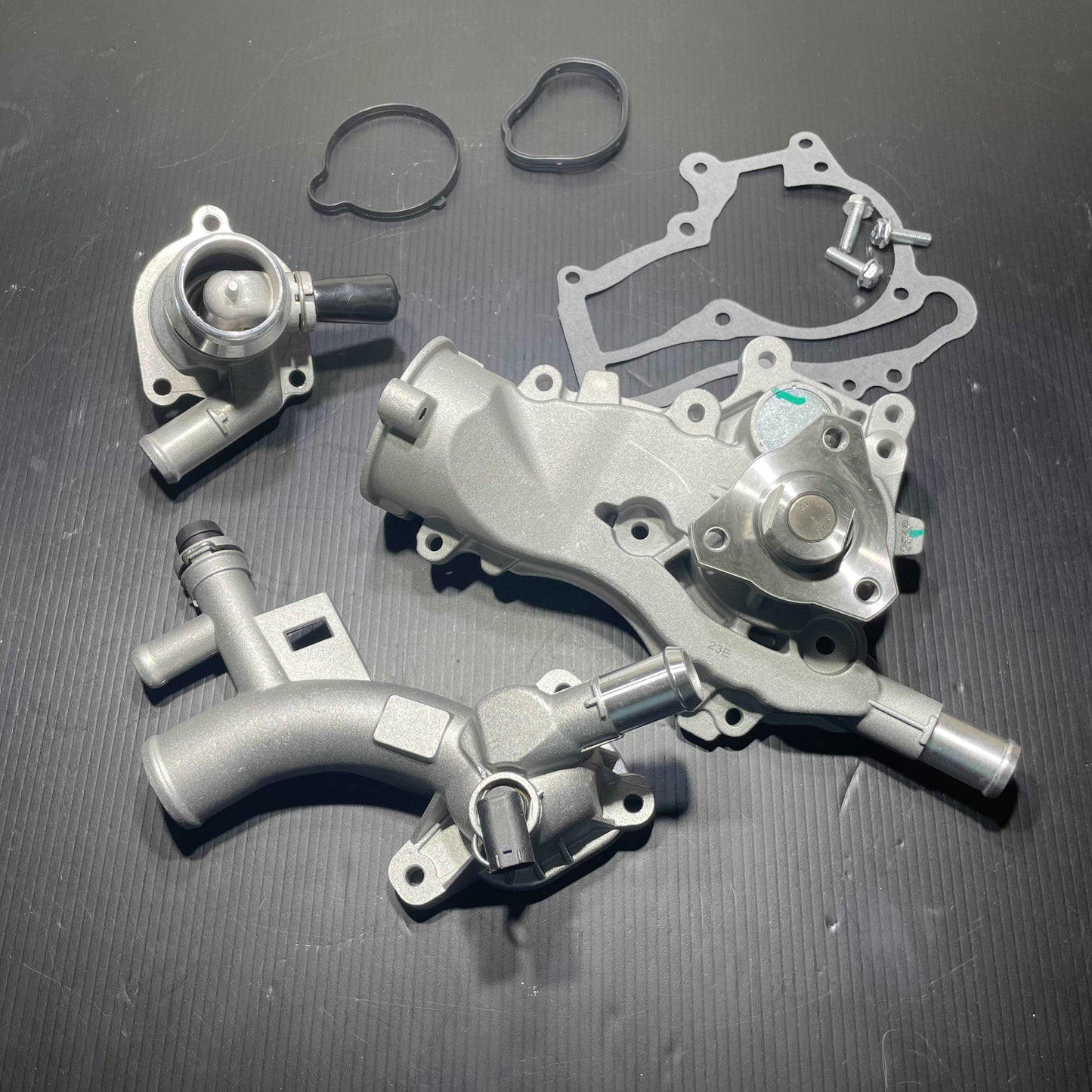 Experience improved performance and durability with Vanderhall 1.4 Aluminum cooling system upgrades. With a rugged aluminum construction and advanced cooling technology, the system boosts heat dissipation, provides efficient protection against overheating, and ensures long-lasting service. This kit will change the plastic parts attached to the engine over to aluminum. The plastic OEM parts are known to crack open over time. Avoid being stranded on the side of the road with these great aluminum upgrades.